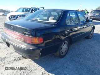 1994 Toyota Camry XLE with VIN JT2GK13E9R0025099, listed as a IAAI auction lot 41735273 with 281,833 mi miles. Bid and sale history available at carsss.com. Image 4.