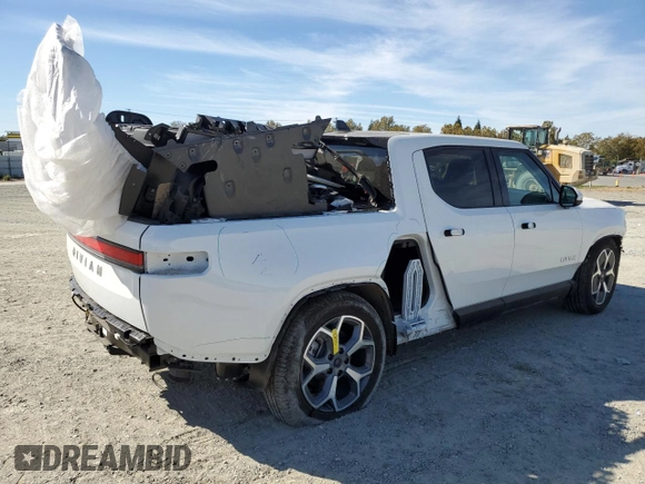 2024 Rivian R1T Adventure z VIN 7FCTGCAA9RN030318, wystawiony jako Copart lot #77036474 z przebiegiem 3 522 mil mil oraz Szkoda całkowita • Salvage title. Historia ofert i sprzedaży dostępna na DreamBid. Obrazek 3.