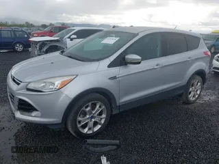 2013 Ford Escape SEL with VIN 1FMCU9H97DUD93157, listed as a IAAI auction lot 41955820 with 244,114 mi miles. Bid and sale history available at carsss.com. Image 2.