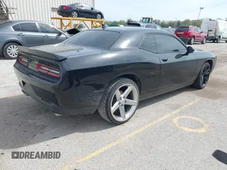 2016 Dodge Challenger R/T Plus with VIN 2C3CDZBT7GH177992, listed as a IAAI auction lot 42136475 with 132,808 mi miles and . Bid and sale history available at DreamBid. Image 4.
