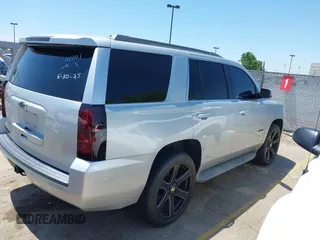 2015 Chevrolet Tahoe LT with VIN 1GNSCBKC9FR111001, listed as a IAAI auction lot 42440624 with 128,087 mi miles and . Bid and sale history available at DreamBid. Image 4.