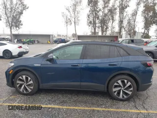 2023 Volkswagen ID.4 Pro z VIN 1V2CMPE88PC028158, wystawiony jako IAAI lot #41538391 z przebiegiem 7159 mil mil oraz . Historia ofert i sprzedaży dostępna na DreamBid. Obrazek 15.