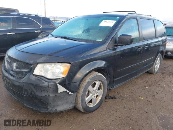 2012 Dodge Grand Caravan SXT with VIN 2C4RDGCG3CR318900, listed as a IAAI auction lot 41145958 with 201,117 mi miles and . Bid and sale history available at DreamBid. Image 2.