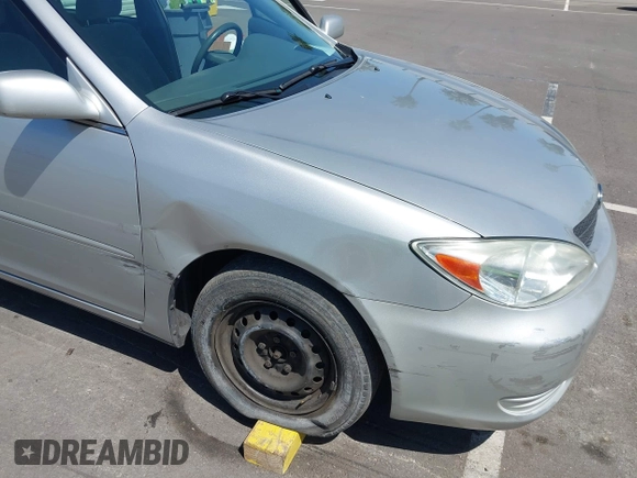2004 Toyota Camry LE with VIN 4T1BE32K74U300025, listed as a IAAI auction lot 42035954 with 115,203 mi miles. Bid and sale history available at carsss.com. Image 6.