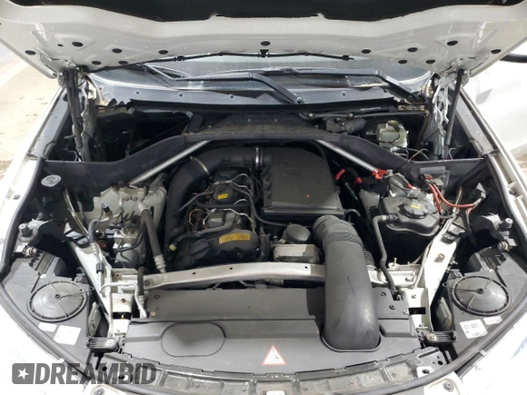2014 BMW X5 xDrive35i z VIN 5UXKR0C5XE0K43083, wystawiony jako Copart lot #59182445 z przebiegiem 163 171 mil mil oraz Szkoda całkowita • Salvage title. Historia ofert i sprzedaży dostępna na DreamBid. Obrazek 12.