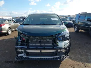 2024 Toyota Sienna XLE with VIN 5TDJSKFC7RS135935, listed as a IAAI auction lot 41409630 with 5,477 mi miles and . Bid and sale history available at DreamBid. Image 13.