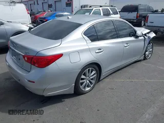 2014 Infiniti Q50 Premium z VIN JN1BV7AP9EM684709, wystawiony jako IAAI lot #41901877 z przebiegiem 91 425 mil mil oraz . Historia ofert i sprzedaży dostępna na DreamBid. Obrazek 4.