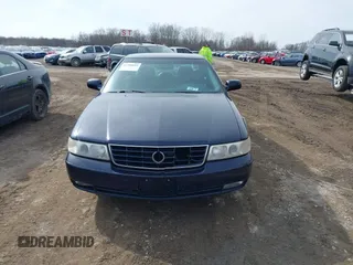 1999 Cadillac Seville Touring STS z VIN 1G6KY5493XU913994, wystawiony jako IAAI lot #41780695 z przebiegiem 60 375 mil mil oraz . Historia ofert i sprzedaży dostępna na DreamBid. Obrazek 6.