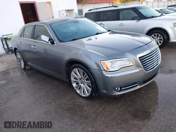 2011 Chrysler 300 with VIN 2C3CA6CTXBH580203, listed as a IAAI auction lot 41751968 with 173,916 mi miles. Bid and sale history available at carsss.com. Image 1.