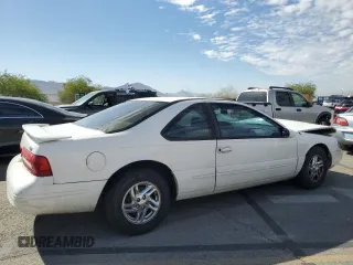 1996 Ford Thunderbird LX z VIN 1FALP62W7TH119284, wystawiony jako Copart lot #71701084 z przebiegiem 239 462 mil mil oraz Szkoda całkowita • Salvage title. Historia ofert i sprzedaży dostępna na DreamBid. Obrazek 3.