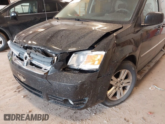 2010 Dodge Grand Caravan Crew with VIN 2D4RN6DX1AR438135, listed as a IAAI auction lot 41734378 with 57,041 mi miles and . Bid and sale history available at DreamBid. Image 12.