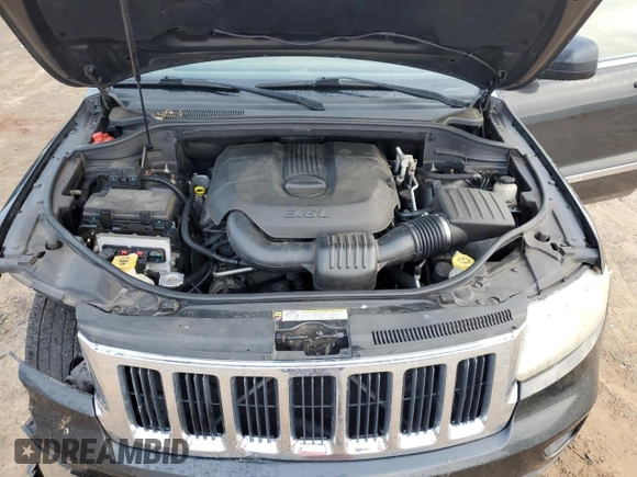 2011 Jeep Grand Cherokee Laredo z VIN 1J4RR4GG0BC518726, wystawiony jako Copart lot #58985765 z przebiegiem 163 625 mil mil oraz Szkoda całkowita • Salvage title. Historia ofert i sprzedaży dostępna na DreamBid. Obrazek 12.