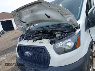 2023 Ford Transit Cargo with VIN 1FTBR3X86PKA69978, listed as a IAAI auction lot 41815672 with 60,590 mi miles and . Bid and sale history available at DreamBid. Image 10.