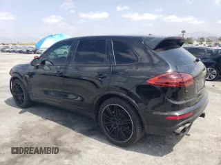 2017 Porsche Cayenne S E-Hybrid with VIN WP1AE2A23HLA71302, listed as a Copart auction lot 54586635 with 102,228 mi miles and Salvage title. Bid and sale history available at DreamBid. Image 2.