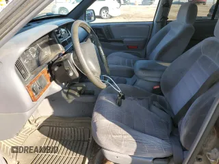 1997 Jeep Grand Cherokee Laredo with VIN 1J4GZ58S9VC687969, listed as a Copart auction lot 79930814 with 0 mi miles and Salvage Title. Bid and sale history available at carsss.com. Image 7.