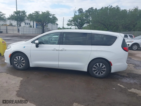 2023 Chrysler Pacifica Hybrid Touring L with VIN 2C4RC1L74PR541551, listed as a IAAI auction lot 42028927 with 57,772 mi miles. Bid and sale history available at carsss.com. Image 14.