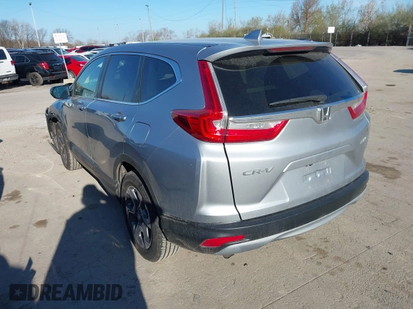 2018 Honda CR-V EX with VIN 7FARW2H56JE097214, listed as a IAAI auction lot 42061999 with 74,862 mi miles and . Bid and sale history available at DreamBid. Image 3.