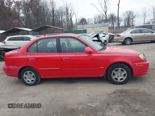 2005 Hyundai Accent GLS with VIN KMHCG45CX5U614083, listed as a IAAI auction lot 41006582 with 72,516 mi miles. Bid and sale history available at carsss.com. Image 13.