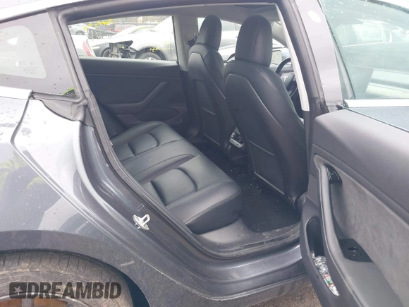 2019 Tesla Model 3 Mid Range with VIN 5YJ3E1EA3KF307415, listed as a IAAI auction lot 41673239 with 42,895 mi miles and . Bid and sale history available at DreamBid. Image 8.