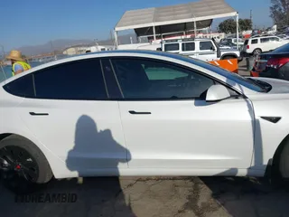 2023 Tesla Model 3 with VIN 5YJ3E1EA0PF503352, listed as a IAAI auction lot 41718658 with 28,426 mi miles and . Bid and sale history available at DreamBid. Image 13.