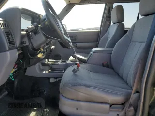 1998 Jeep Cherokee Sport with VIN 1J4FJ68S3WL150458, listed as a Copart auction lot 63278935 with 176,314 mi miles and Clean title. Bid and sale history available at DreamBid. Image 7.