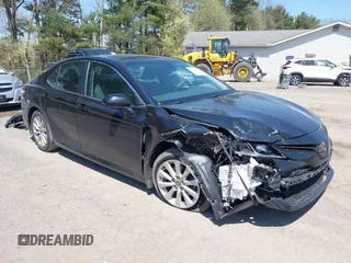 2020 Toyota Camry LE with VIN 4T1C11AK9LU387012, listed as a IAAI auction lot 42103647 with 64,049 mi miles. Bid and sale history available at carsss.com. Image 1.