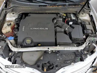 2014 Lincoln MKZ z VIN 3LN6L2GK8ER805655, wystawiony jako Copart lot #58504055 z przebiegiem 119 317 mil mil oraz Szkoda całkowita • Salvage title. Historia ofert i sprzedaży dostępna na DreamBid. Obrazek 11.