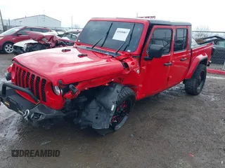 2021 Jeep Gladiator Freedom z VIN 1C6HJTAG0ML547293, wystawiony jako IAAI lot #41926067 z przebiegiem 57 696 mil mil oraz . Historia ofert i sprzedaży dostępna na DreamBid. Obrazek 2.