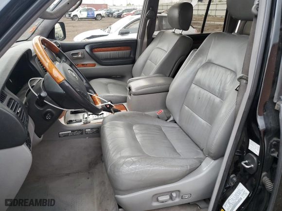 2003 Lexus LX 470 with VIN JTJHT00W333526380, listed as a Copart auction lot 77356534 with 151,636 mi miles and Salvage Title. Bid and sale history available at carsss.com. Image 7.