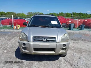 2006 Hyundai Tucson GL with VIN KM8JM12BX6U249982, listed as a IAAI auction lot 41976033 with 107,153 mi miles. Bid and sale history available at carsss.com. Image 12.