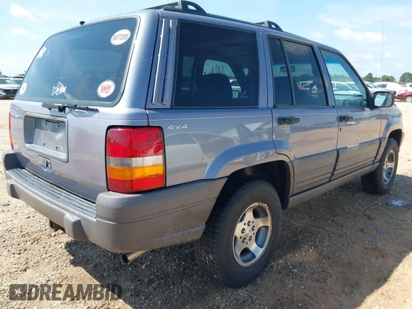 1996 Jeep Grand Cherokee with VIN 1J4EZ58S5TC149533, listed as a IAAI auction lot 42456529 with 173,872 mi miles and . Bid and sale history available at DreamBid. Image 4.