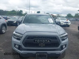 2021 Toyota Tacoma SR with VIN 5TFCZ5AN3MX258746, listed as a IAAI auction lot 42252967 with 62,095 mi miles and . Bid and sale history available at DreamBid. Image 12.