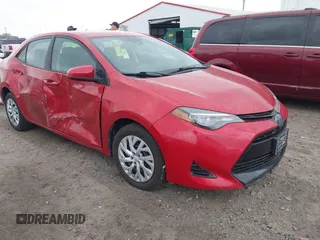 2018 Toyota Corolla L z VIN 5YFBURHE4JP750297, wystawiony jako IAAI lot #41972860 z przebiegiem 100 781 mil mil oraz . Historia ofert i sprzedaży dostępna na DreamBid. Obrazek 1.