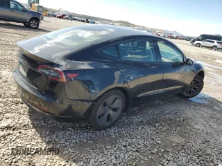 2023 Tesla Model 3 with VIN 5YJ3E1EAXPF708001, listed as a Copart auction lot 57252735 with 71,579 mi miles and Salvage title. Bid and sale history available at DreamBid. Image 3.