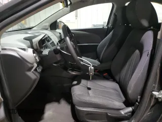 2014 Chevrolet Sonic LT with VIN 1G1JC5SH4E4239958, listed as a Copart auction lot 46082295 with 128,275 mi miles and Salvage Title. Bid and sale history available at DreamBid. Image 7.