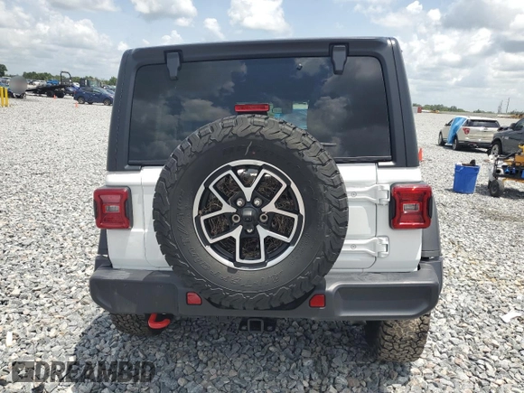 2024 Jeep Wrangler Rubicon z VIN 1C4PJXFG9RW336006, wystawiony jako Copart lot #60237785 z przebiegiem 24 571 mil mil oraz Czysty tytuł • Clean title. Historia ofert i sprzedaży dostępna na DreamBid. Obrazek 6.