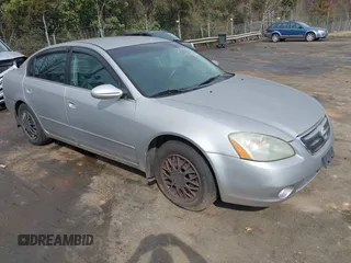 2003 Nissan Altima S with VIN 1N4AL11D23C290009, listed as a IAAI auction lot 41813061 with 247,427 mi miles. Bid and sale history available at carsss.com. Image 1.