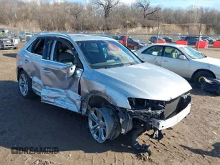 2018 Audi Q3 Premium Plus with VIN WA1JCCFS4JR030776, listed as a IAAI auction lot 41709645 with 73,953 mi miles. Bid and sale history available at carsss.com. Image 1.