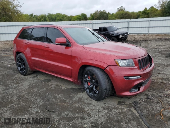 2012 Jeep Grand Cherokee SRT8 with VIN 1C4RJFDJ0CC351195, listed as a Copart auction lot 72794454 with 104,672 mi miles and Salvage Title. Bid and sale history available at carsss.com. Image 4.
