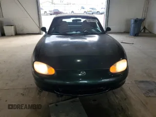 1999 Mazda MX-5 Miata z VIN JM1NB353XX0111850, wystawiony jako Copart lot #53076805 z przebiegiem 128 707 mil mil oraz Szkoda całkowita • Salvage title. Historia ofert i sprzedaży dostępna na DreamBid. Obrazek 5.