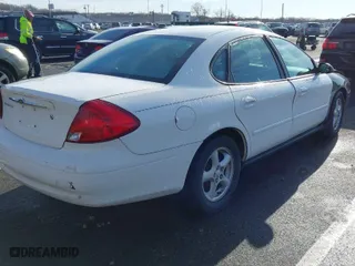 2003 Ford Taurus SE Standard with VIN 1FAFP53U13G210075, listed as a IAAI auction lot 41863786 with 64,943 mi miles. Bid and sale history available at carsss.com. Image 4.