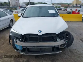 2018 BMW X1 sDrive28i with VIN WBXHU7C38J5L05985, listed as a IAAI auction lot 42014649 with 77,082 mi miles. Bid and sale history available at carsss.com. Image 13.