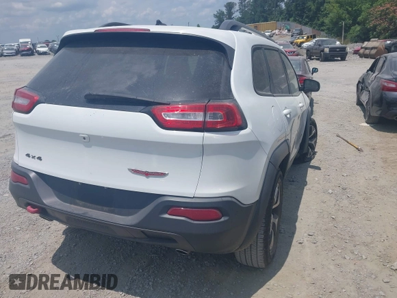 2015 Jeep Cherokee Trailhawk z VIN 1C4PJMBS3FW511564, wystawiony jako IAAI lot #42424468 z przebiegiem 169 167 mil mil oraz . Historia ofert i sprzedaży dostępna na DreamBid. Obrazek 4.