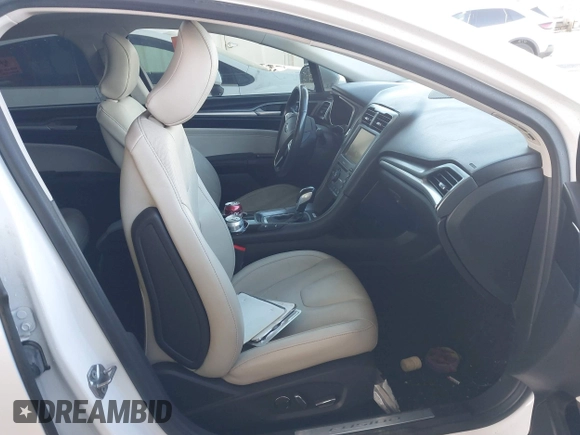 2016 Ford Fusion Titanium Hybrid with VIN 3FA6P0RU1GR191813, listed as a IAAI auction lot 41560954 with 86,922 mi miles. Bid and sale history available at carsss.com. Image 5.