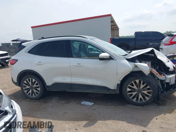 2020 Ford Escape Titanium Hybrid with VIN 1FMCU0DZ9LUA54867, listed as a IAAI auction lot 42268245 with 68,974 mi miles and . Bid and sale history available at DreamBid. Image 13.