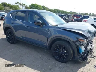 2023 Mazda CX-5 2.5 S Carbon Edition with VIN JM3KFBCM1P0106881, listed as a IAAI auction lot 41610768 with 21,184 mi miles. Bid and sale history available at carsss.com. Image 1.