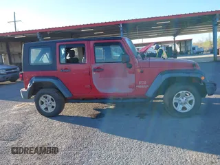 2009 Jeep Wrangler Unlimited X with VIN 1J4GZ39179L763057, listed as a IAAI auction lot 41829248 with 151,018 mi miles. Bid and sale history available at carsss.com. Image 13.