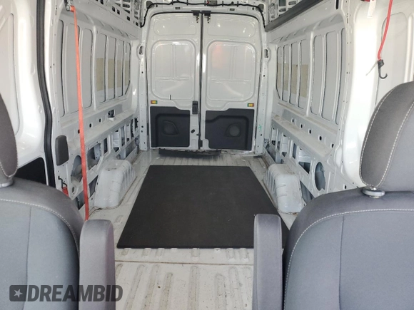 2023 Ford Transit Cargo with VIN 1FTBR3X86PKA19338, listed as a Copart auction lot 52677015 with 93,268 mi miles and Salvage Title. Bid and sale history available at DreamBid. Image 10.