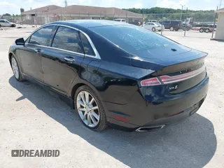 2016 Lincoln MKZ z VIN 3LN6L2J93GR632474, wystawiony jako IAAI lot #42607060 z przebiegiem 99 490 mil mil oraz . Historia ofert i sprzedaży dostępna na DreamBid. Obrazek 3.