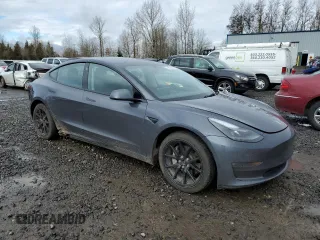 2023 Tesla Model 3 Long Range with VIN 5YJ3E1EB6PF686927, listed as a Copart auction lot 45602285 with 46,534 mi miles and Salvage Title. Bid and sale history available at DreamBid. Image 4.